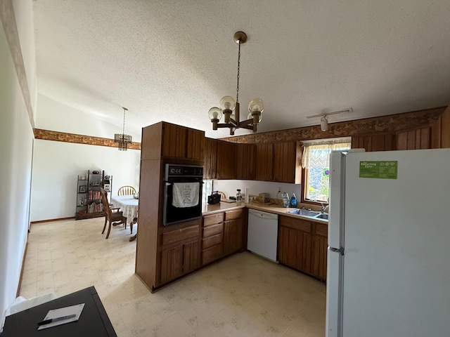 7996 Corey Path, Inver Grove Heights, MN 55076 - kitchen featuring white appliances, a chandelier, light floors, a sink, and a textured ceiling