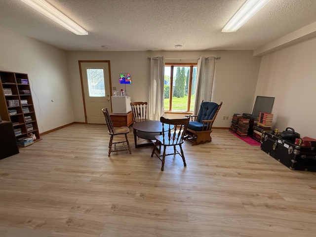 7996 Corey Path, Inver Grove Heights, MN 55076 - dining area featuring a textured ceiling, light wood finished floors, and baseboards