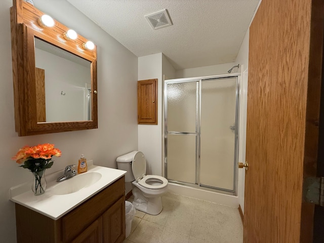 7996 Corey Path, Inver Grove Heights, MN 55076 - bathroom featuring toilet, a shower stall, vanity, and a textured ceiling