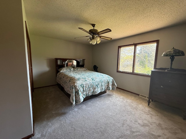 7996 Corey Path, Inver Grove Heights, MN 55076 - carpeted bedroom with baseboards, ceiling fan, and a textured ceiling