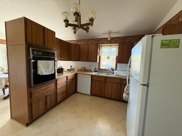 7996 Corey Path, Inver Grove Heights, MN 55076 - kitchen with white appliances, a chandelier, light countertops, light flooring, and a textured ceiling