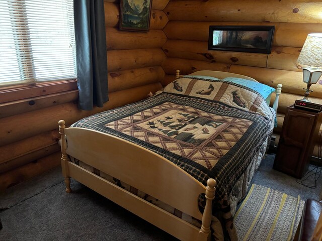 47241 186th Pl, Mcgregor, MN 55760 - carpeted bedroom featuring log walls