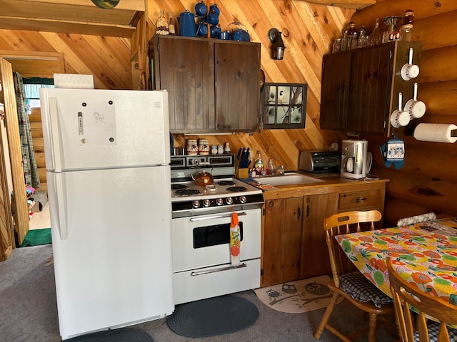 47241 186th Pl, Mcgregor, MN 55760 - kitchen with white appliances, light colored carpet, and wood walls