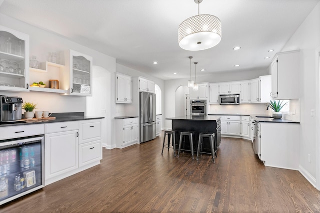 16500 Irwindale Way, Lakeville, MN 55044 - kitchen featuring appliances with stainless steel finishes, beverage cooler, dark countertops, white cabinetry, and dark wood finished floors