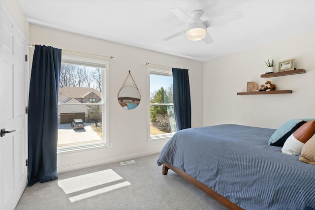 16500 Irwindale Way, Lakeville, MN 55044 - carpeted bedroom featuring multiple windows, baseboards, and a ceiling fan