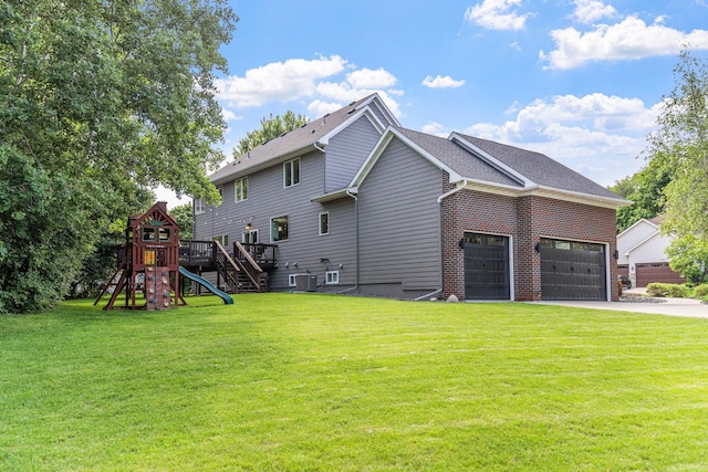 16500 Irwindale Way, Lakeville, MN 55044 - view of side of property featuring an attached garage, driveway, a yard, central air condition unit, and a playground