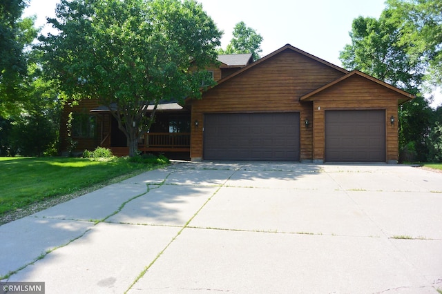 1706 Fairway Dr, Glencoe, MN 55336 - view of front of home with a garage, a front yard, concrete driveway, and a porch