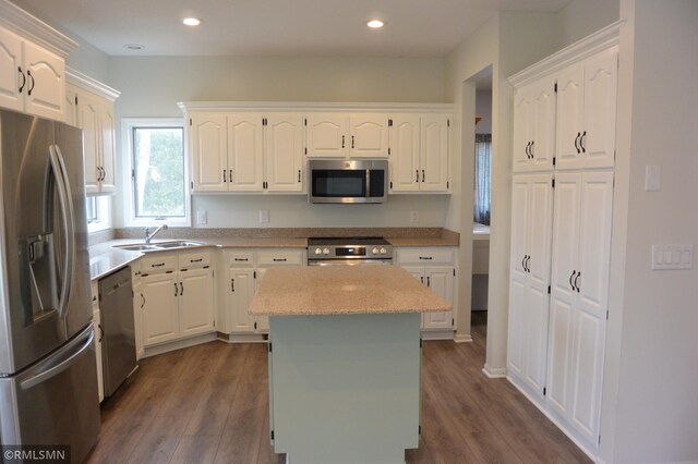 1706 Fairway Dr, Glencoe, MN 55336 - kitchen featuring appliances with stainless steel finishes, a sink, white cabinets, and recessed lighting