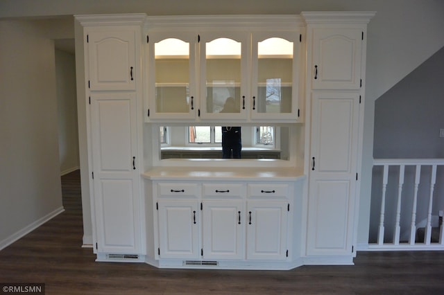 1706 Fairway Dr, Glencoe, MN 55336 - bar area featuring dark wood-style flooring and baseboards