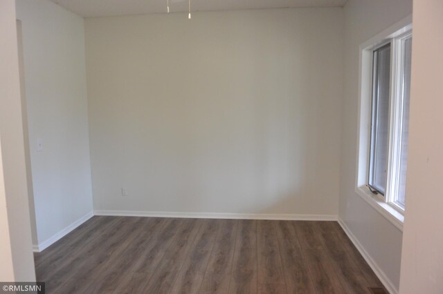 1706 Fairway Dr, Glencoe, MN 55336 - unfurnished room with dark wood-style flooring and baseboards