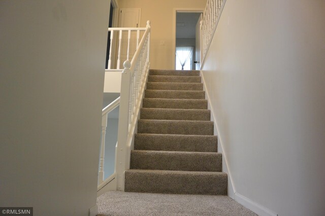 1706 Fairway Dr, Glencoe, MN 55336 - stairs featuring baseboards