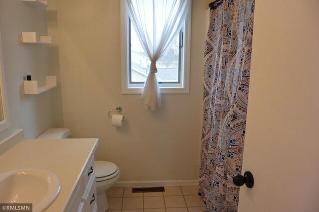 1706 Fairway Dr, Glencoe, MN 55336 - bathroom with tile patterned flooring, vanity, toilet, baseboards, and a shower with curtain