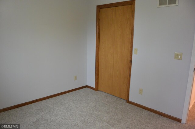 1706 Fairway Dr, Glencoe, MN 55336 - unfurnished bedroom with carpet, baseboards, and a closet