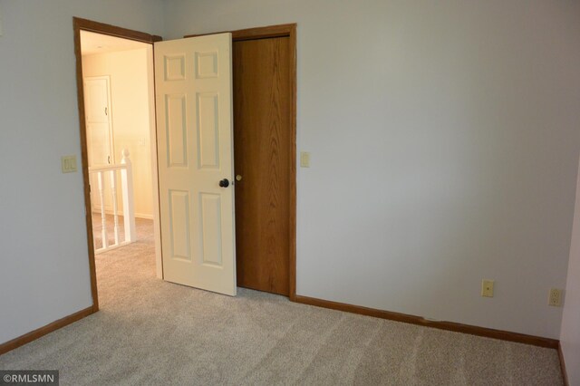 1706 Fairway Dr, Glencoe, MN 55336 - carpeted empty room featuring baseboards