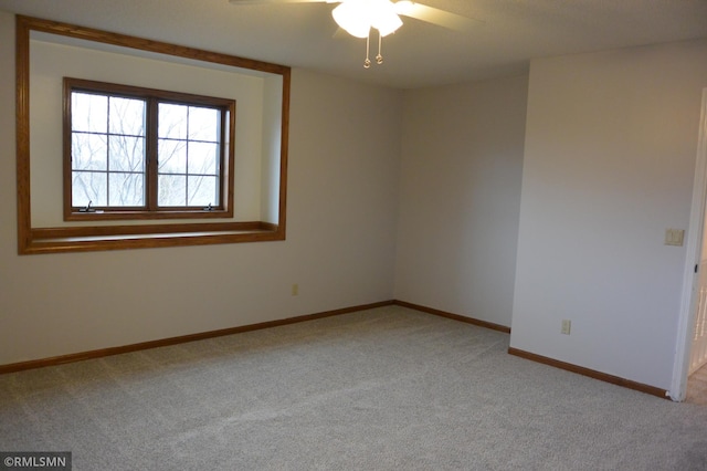 1706 Fairway Dr, Glencoe, MN 55336 - spare room with light colored carpet, a ceiling fan, and baseboards