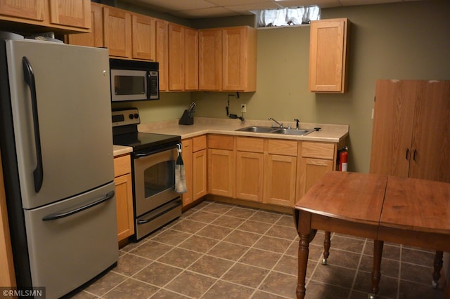 1706 Fairway Dr, Glencoe, MN 55336 - kitchen featuring appliances with stainless steel finishes, light countertops, a sink, light brown cabinetry, and a paneled ceiling