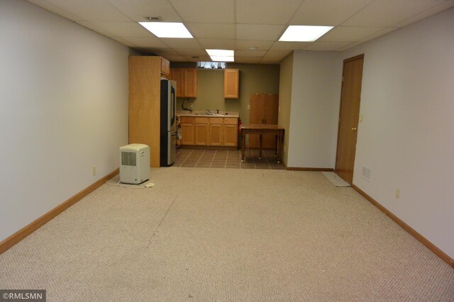1706 Fairway Dr, Glencoe, MN 55336 - unfurnished living room with light colored carpet, a paneled ceiling, baseboards, and a sink