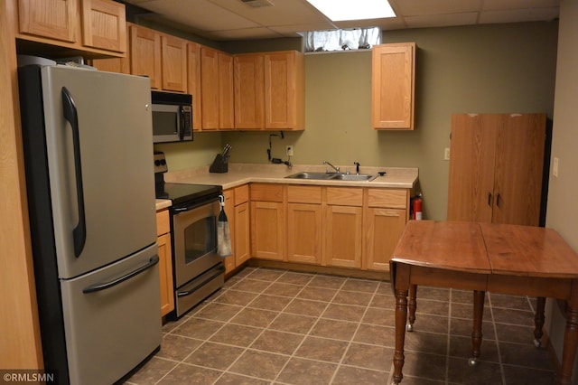 1706 Fairway Dr, Glencoe, MN 55336 - kitchen with stainless steel appliances, a sink, a paneled ceiling, light countertops, and light brown cabinetry