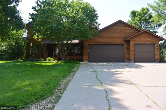 1706 Fairway Dr, Glencoe, MN 55336 - view of front of property with a front yard, driveway, an attached garage, and a porch