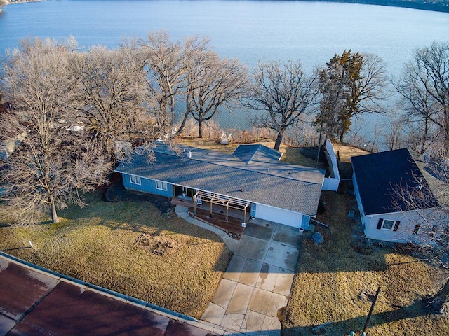 aerial view of property and surrounding area featuring a nearby body of water