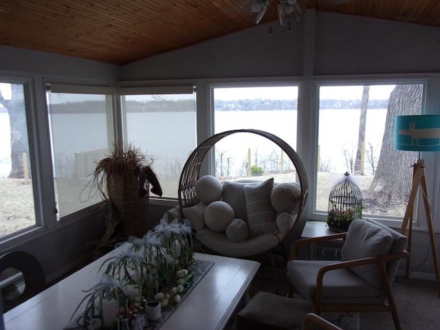sunroom / solarium with vaulted ceiling, a water view, wood ceiling, and carpet flooring