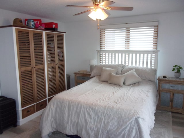 bedroom with a closet and a ceiling fan