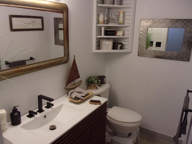 half bath featuring toilet and vanity