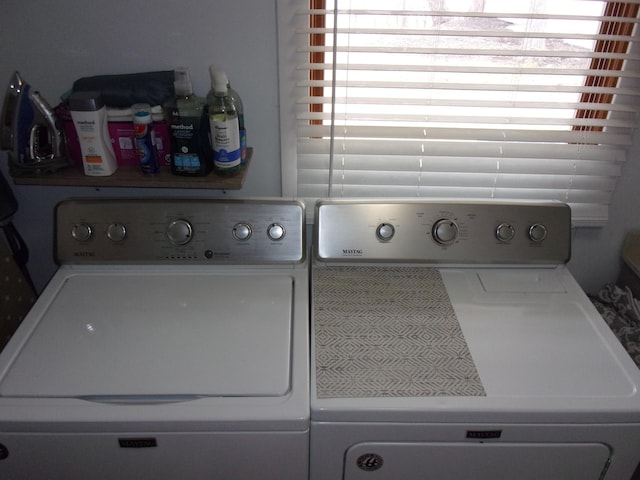 laundry area with washing machine and dryer
