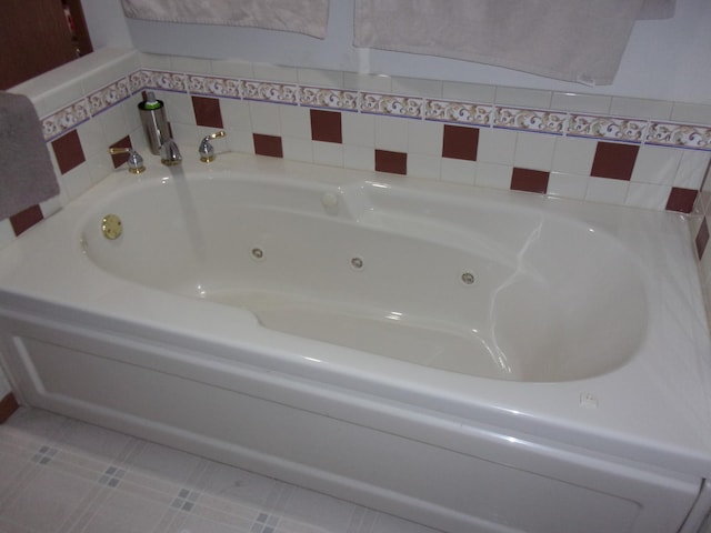full bath with a jetted tub