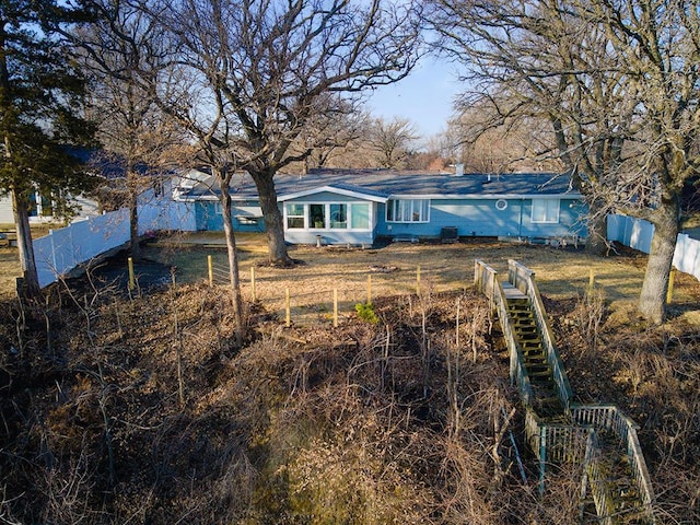 back of property with fence