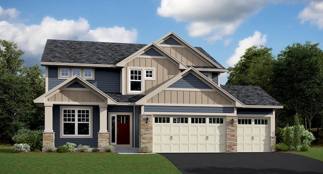 craftsman house featuring aphalt driveway, stone siding, board and batten siding, and a front yard