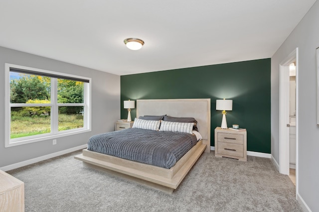 bedroom with carpet floors and baseboards