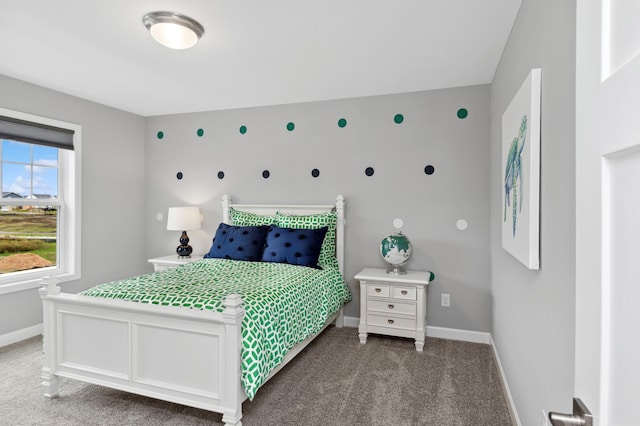 bedroom with baseboards and carpet floors