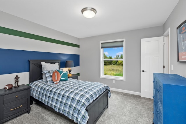 carpeted bedroom featuring baseboards