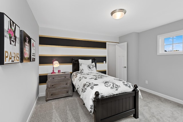 carpeted bedroom with baseboards