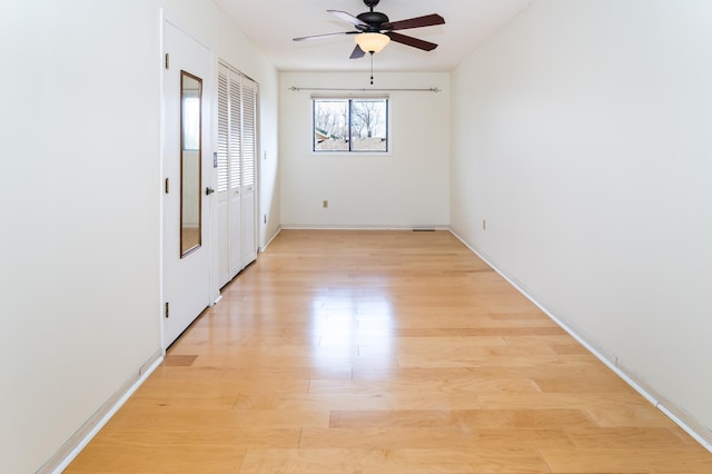2749 Terraceview Ln N, Plymouth, MN 55447 - unfurnished room with light wood-type flooring, ceiling fan, and baseboards