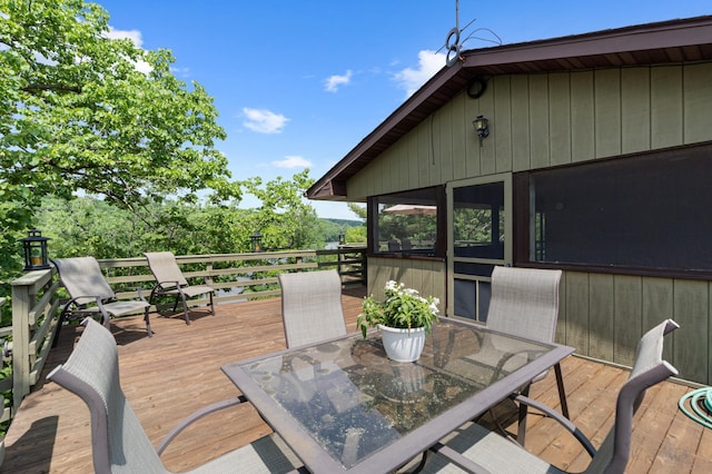 1109 Hamilton St, Saint Croix Falls, WI 54024 - wooden terrace with outdoor dining space and a sunroom