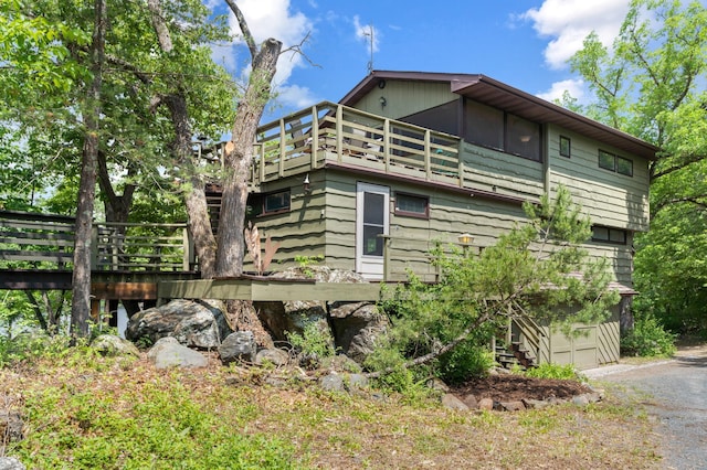 1109 Hamilton St, Saint Croix Falls, WI 54024 - view of side of property featuring a balcony and gravel driveway