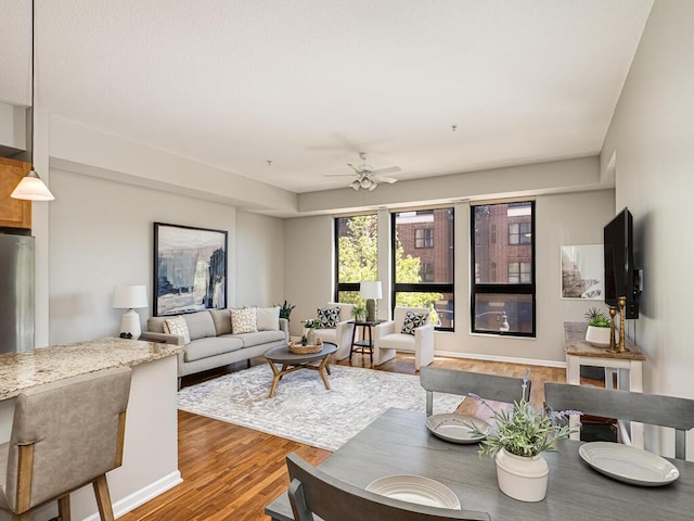 4730 Park Commons Dr Unit 215, Saint Louis Park, MN 55416 - living room featuring wood finished floors and a ceiling fan