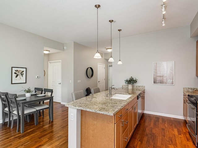 4730 Park Commons Dr Unit 215, Saint Louis Park, MN 55416 - kitchen with a sink, stainless steel appliances, a peninsula, and dark wood-style floors