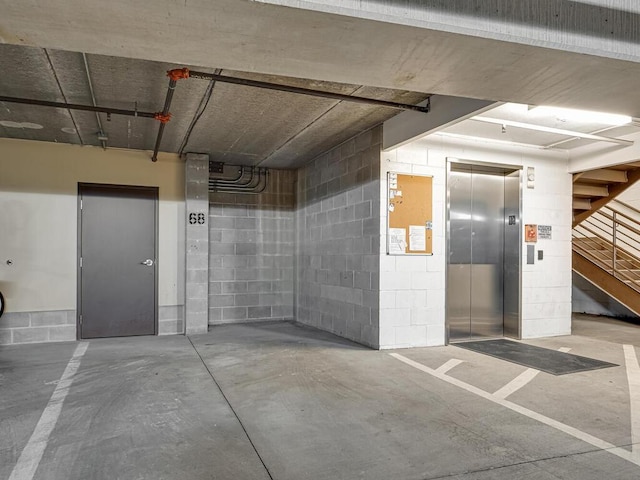 4730 Park Commons Dr Unit 215, Saint Louis Park, MN 55416 - parking deck with elevator and concrete block wall