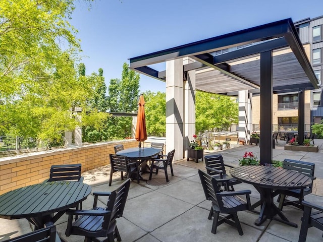 4730 Park Commons Dr Unit 215, Saint Louis Park, MN 55416 - view of patio featuring outdoor dining area and a pergola