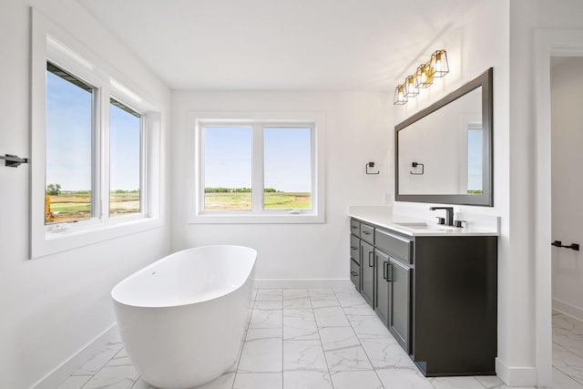 13937 Ember Ct, Apple Valley, MN 55124 - full bathroom featuring marble look tile flooring, baseboards, vanity, and a soaking tub