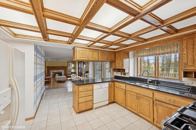 kitchen with dark countertops, a sink, white appliances, a peninsula, and coffered ceiling