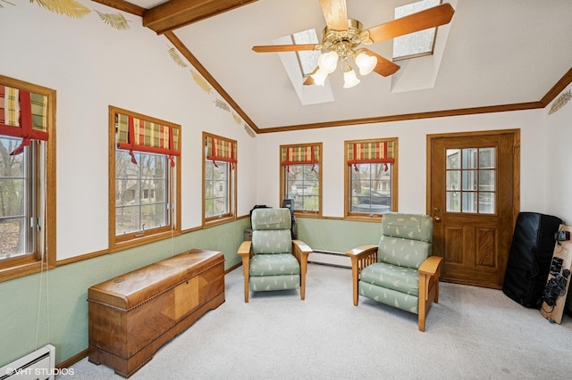sitting room with baseboard heating, carpet, lofted ceiling with skylight, and a wealth of natural light
