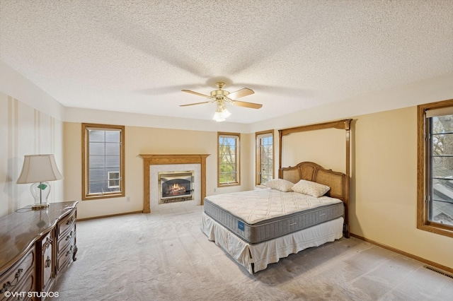 bedroom with visible vents, multiple windows, and light carpet