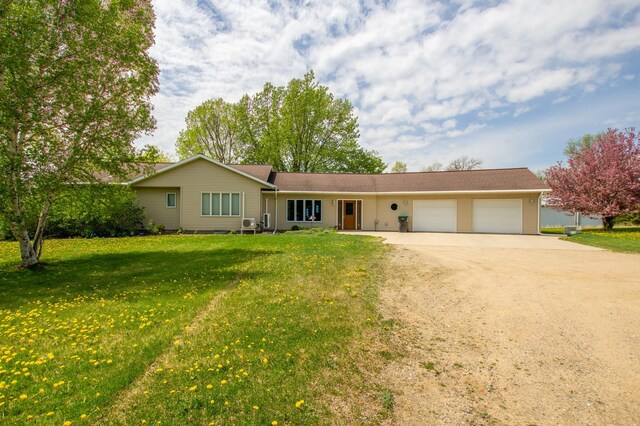 17367 Gull Lake Loop Rd NE, Bemidji, MN 56601 - ranch-style home with driveway, an attached garage, and a front lawn