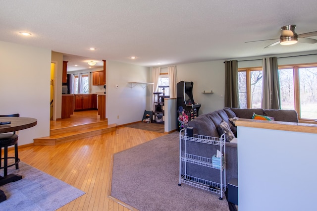17367 Gull Lake Loop Rd NE, Bemidji, MN 56601 - living room with light wood-type flooring, healthy amount of natural light, recessed lighting, ceiling fan, and a textured ceiling