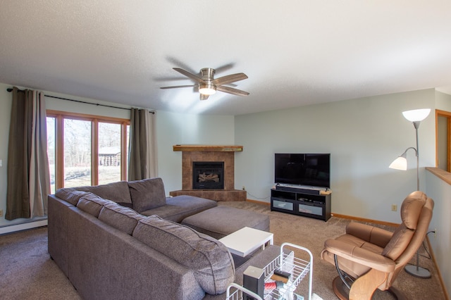 17367 Gull Lake Loop Rd NE, Bemidji, MN 56601 - living area with carpet, a ceiling fan, a tile fireplace, a baseboard radiator, and baseboards