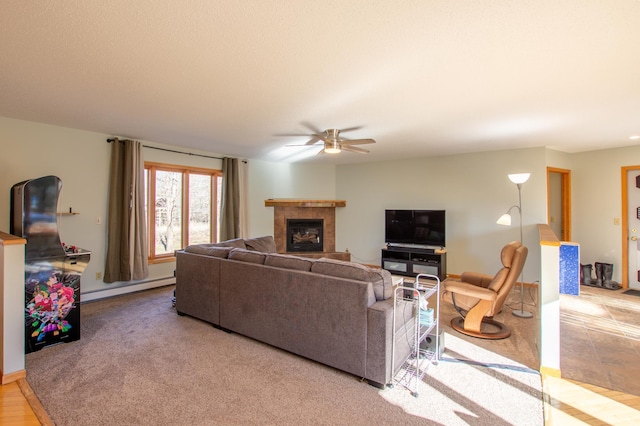 17367 Gull Lake Loop Rd NE, Bemidji, MN 56601 - living room featuring baseboard heating, a ceiling fan, and a fireplace